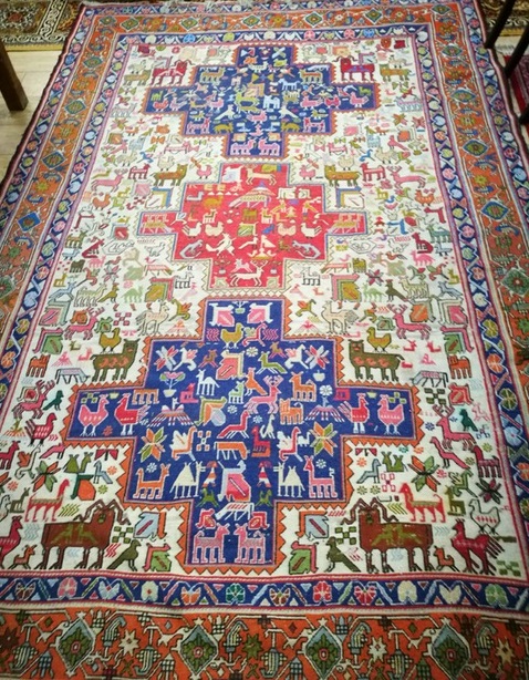 A Persian nomadic geometric animal design rug 290 x 197cm